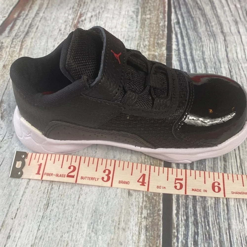 Kids Jordan 11 CMFT LOW Black Sneakers with Red Accents SIZE 8C